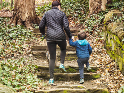 Parent walking with child and dog